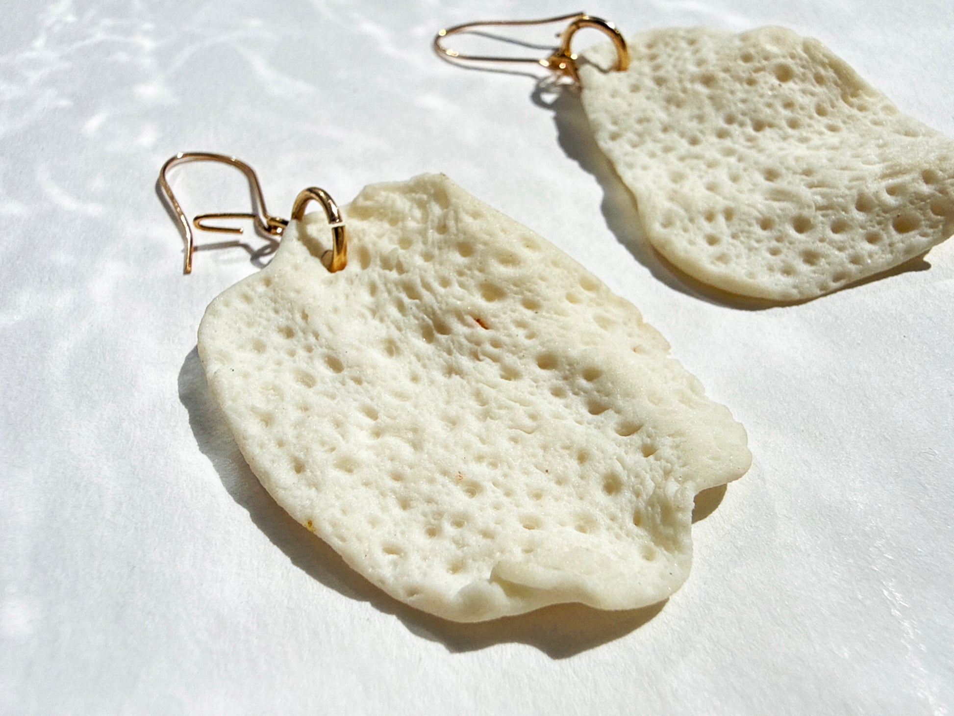 porcelain earrings with a sea urchin print